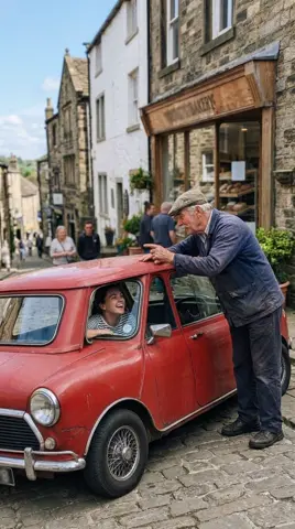 Photo 3: Dad at the car window, pointing up the hill