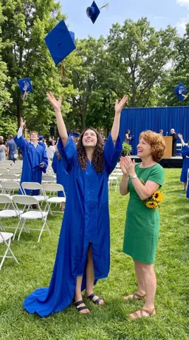 Photo 4: graduates throwing their caps in the air, the mother clapping